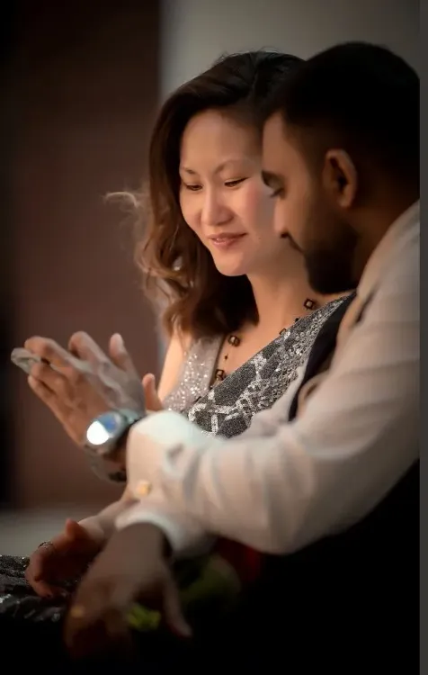 Couple sharing a quiet candlelit moment during their wedding celebration