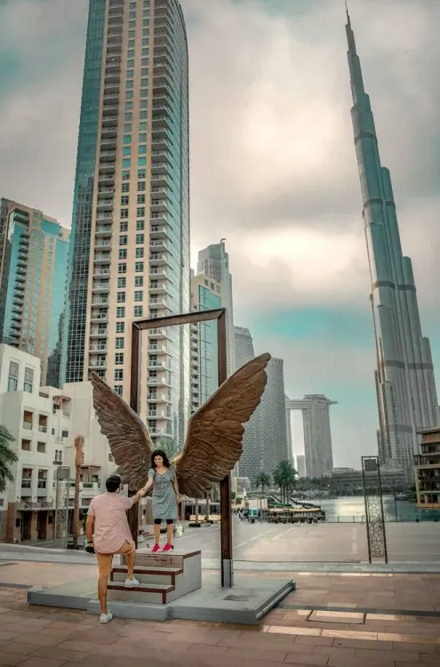 Couple posing against the Dubai skyline with the Burj Khalifa in the background