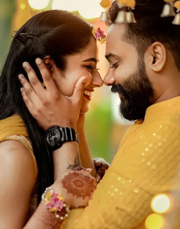 Couple sharing a joyful moment during their Haldi ceremony